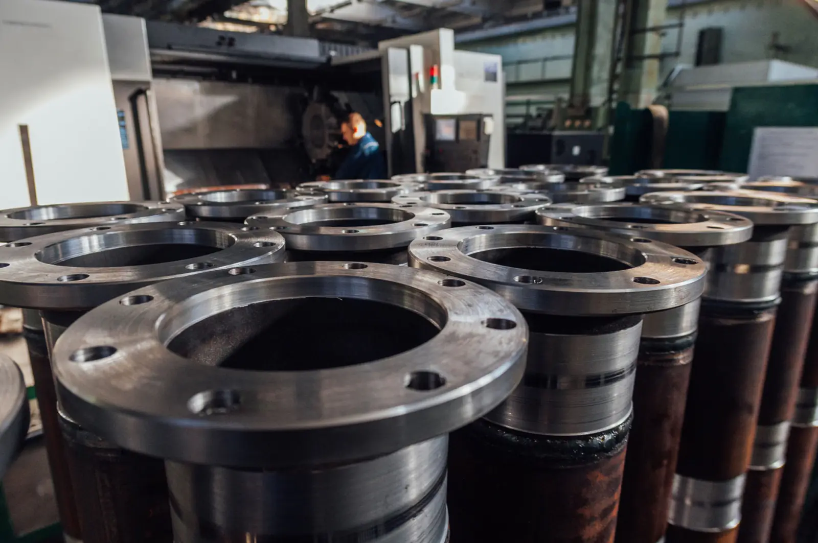 Forged steel flanges in the workshop before machining